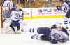Chris Szagola / the associated press archives
Jets goalie Ondrej Pavelec doesn't mind the shot-blocking help of defencemen such as Jacob Trouba, even if it means the odd deflection ends up in the net.