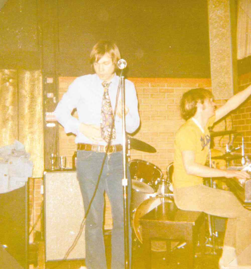 Fabulous George (a.k.a. Don Jordan) handles vocal duties at the Fireplace while Dave Pybus (right) plays piano.