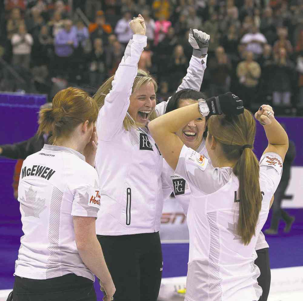 Jason Halstead
Jason Halstead / Winnipeg Free Press
Skip Jennifer Jones and teammates Dawn McEwen (from left), Jill Officer and Kaitlyn Lawes soak up the moment after earning their Olympic berth Saturday.