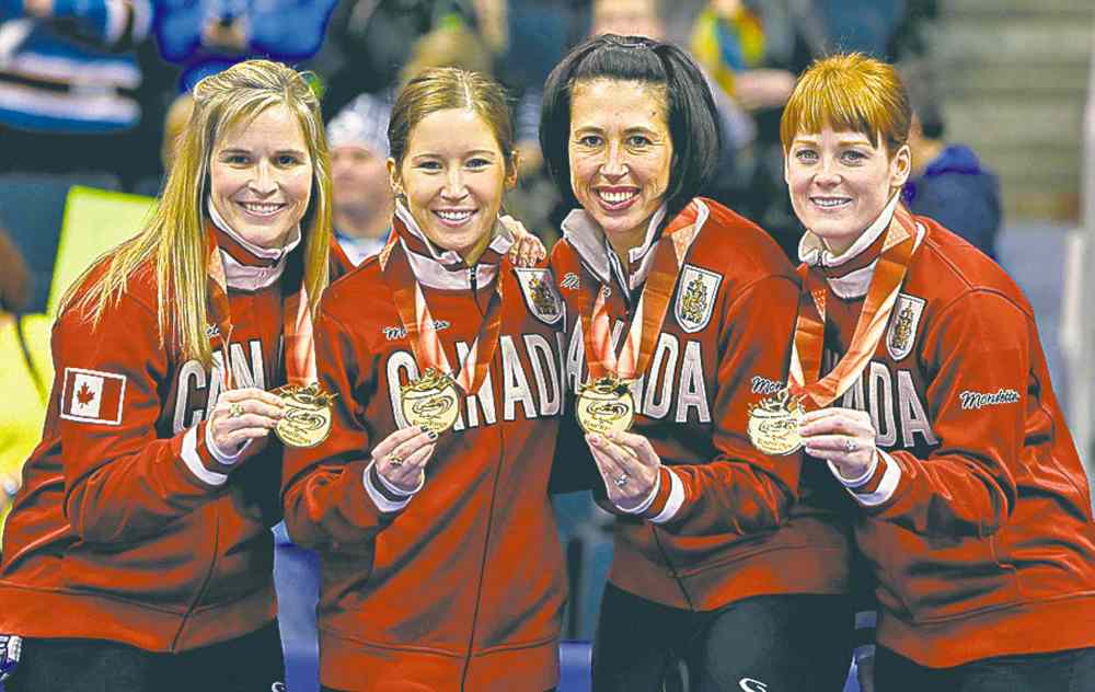 Jason Halstead
From left, skip Jennifer Jones and her team, Kaitlyn Lawes, Jill Officer and Dawn McEwen celebrate after defeating Sherry Middaugh in the women's final of Roar of the Rings curling at the MTS Centre on Sat., Dec. 7, 2013 to win the right to represent Canada at the Winter Olympics in Sochi, Russia, in February.