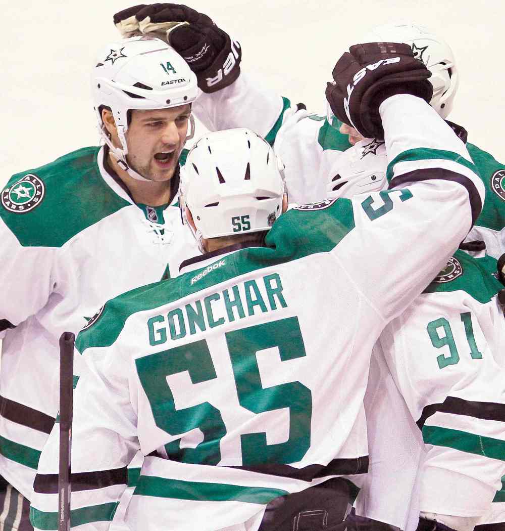 CP
John Woods / the canadian press
Dallas Stars captain Jamie Benn (14), Sergei Gonchar and Tyler Seguin (91) celebrate a Seguin goal.