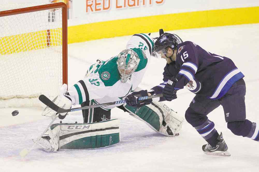 CP
John Woods / the canadian press
Winnipeg Jets winger Matt Halischuk scores on Dallas Stars goaltender Kari Lehtonen to tie the game 1-1 in the first period on Saturday.