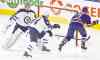 Jason Franson /The Canadian Press files
Jets goalie Ondrej Pavelec and D-man Zach Bogosian hustle to reach the general vicinity of the net too late in Edmonton on Monday.