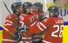 Frank Gunn / THE CANADIAN PRESS
Winnipeg Jets prospect and Team Canada sniper Nic Petan (19) is swarmed by teammates in Sweden after potting the winner against Slovakia.