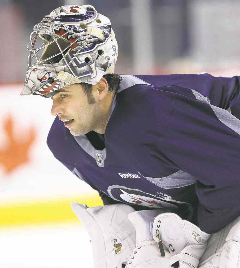 JOE BRYKSA / WINNIPEG FREE PRESS files
Yanked against Minnesota a week ago, Jets goaltender Ondrej Pavelec makes his return to the net today in Beantown.