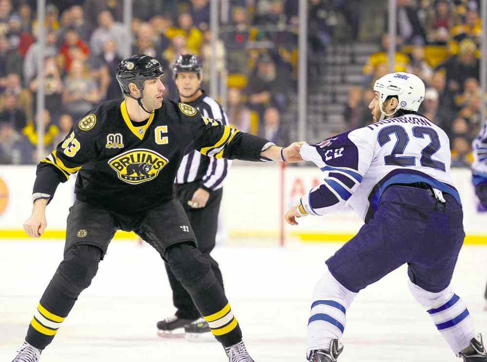 USA Today Sports
Bob DeChiara / USA TODAY Sports
Shall we dance? Bruins defenceman Zdeno Chara (33) and Jets right-winger Chris Thorburn threw hands in the first period.