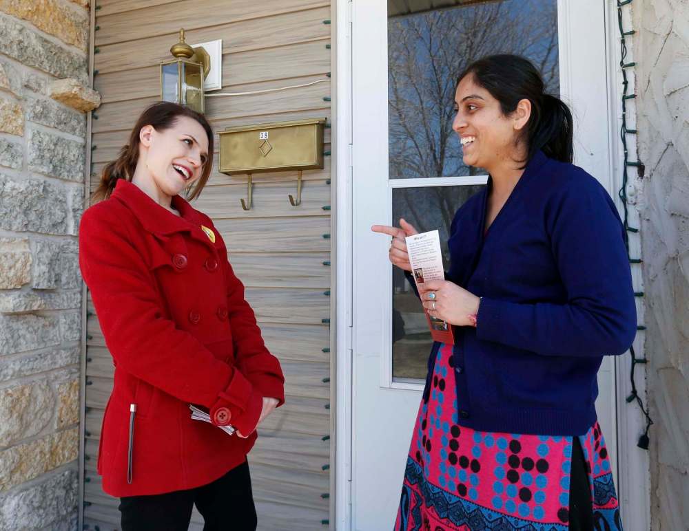 WAYNE GLOWACKI / WINNIPEG FREE PRESS
Liberal candidate Cindy Lamoureux (left) in her Burrows riding Wednesday talks to Navdeep Bedi at her home.