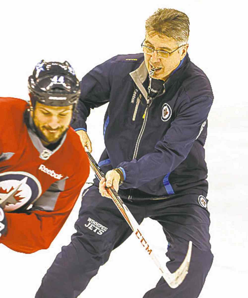 Ken Gigliotti / Winnipeg Free Press
Head coach Claude Noel lays a little lumber on defenceman Zach Bogosian Thursday at practice.