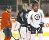 ken gigliotti / winnipeg free press
Dustin Byfuglien (right, with Zach Bogosian and Ondrej Pavelec) practised Thursday as a forward, fuelling speculation he might move up.