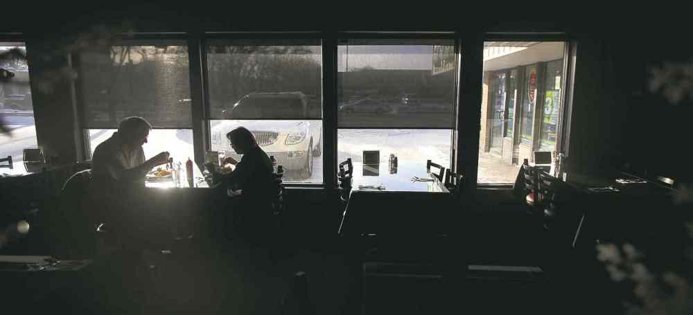 Phil Hossack / Winnipeg Free Press
The Oakwood Cafe. Customers are silhouetted against the cafe's large windows facing Osborne South.