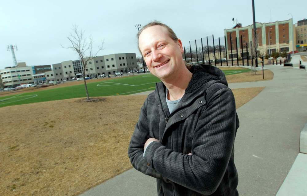 BORIS MINKEVICH / WINNIPEG FREE PRESS
NDP candidate Rob Altemeyer stands in front of Gordon Bell High School’s green space/soccer field. That’s probably the only green he wants to see in the NDP stronghold.