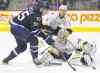John Woods / WINNIPEG FREE PRESS 
Jets' Mark Scheifele gets around Predators goaltender Carter Hutton before shooting the puck off Shea Weber for a goal.