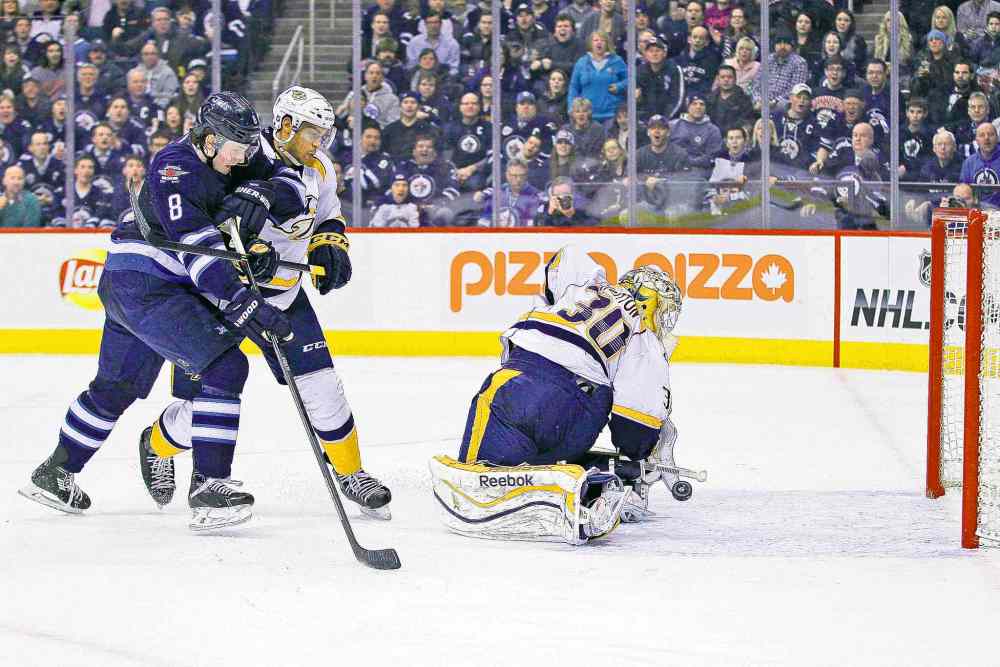 John Woods / WINNIPEG FREE PRESS
Predators goaltender Carter Hutton watches a shot from Jets' Blake Wheeler trickle into the net as Jets' Jacob Trouba and Preds' Seth Jones look on Tuesday.