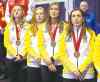Ryan Remiorz / The Canadian Press
Chelsea Carey (from left) and teammates Kristy McDonald, Kristen Foster and Lindsay Titheridge receive their medals.