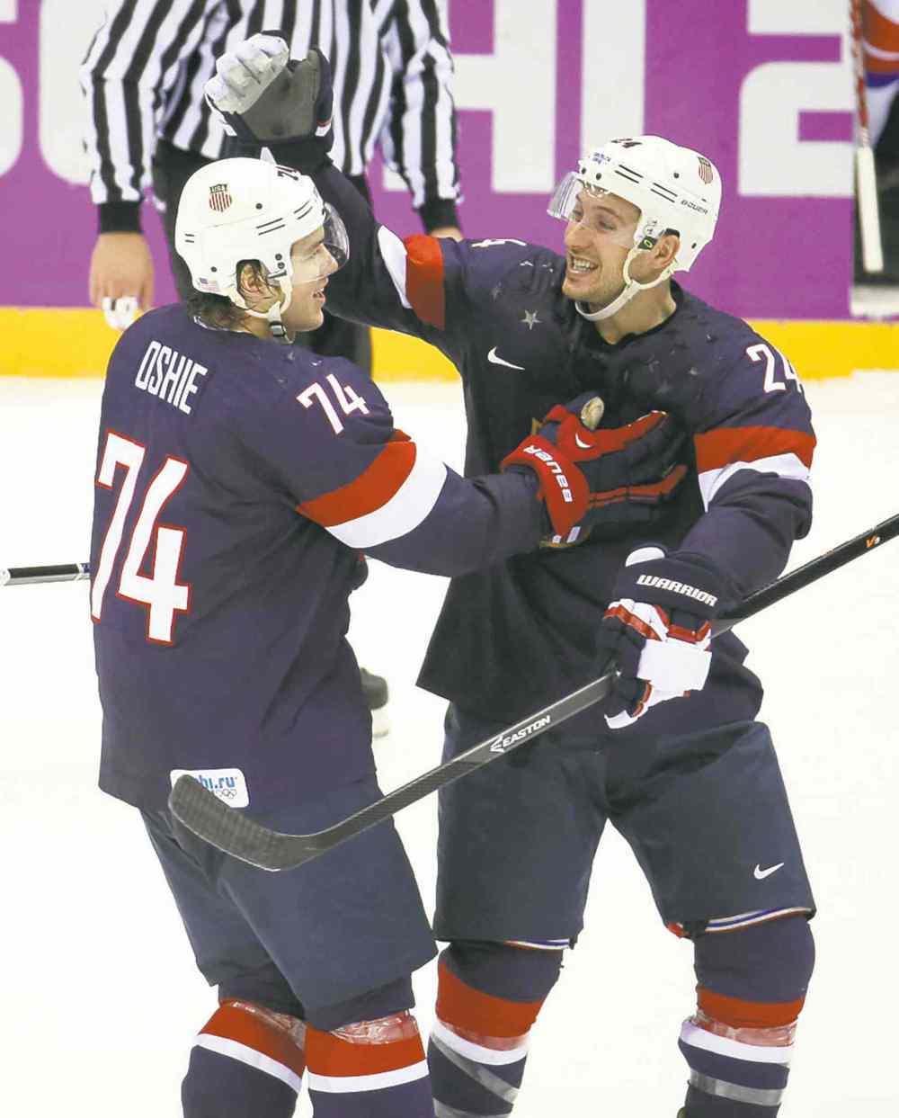 Tribune Media MCT
Brian Cassella / Chicago Tribune / MCT
The deciding factor in T.J. Oshie, left, (with Ryan Callahan) making the U.S. Olympic team was his success in shootouts, which paid off against Russia.