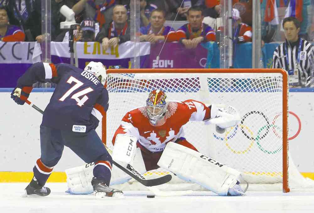The Associated Press
Mark Humphrey / the associated press
T.J. Oshie was the hero for the U.S. Olympic hockey team Saturday, bulging the twine on four of six attempts in the American�s shootout victory over the Russians.