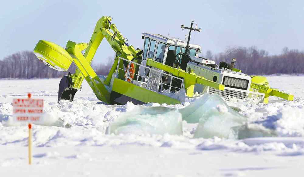 Wayne Glowacki / Winnipeg Free Press
One of three Amphibex icebreaking machines heads out on the Red River north of Selkirk Tuesday morning in an effort to reduce the threat of ice jams later.