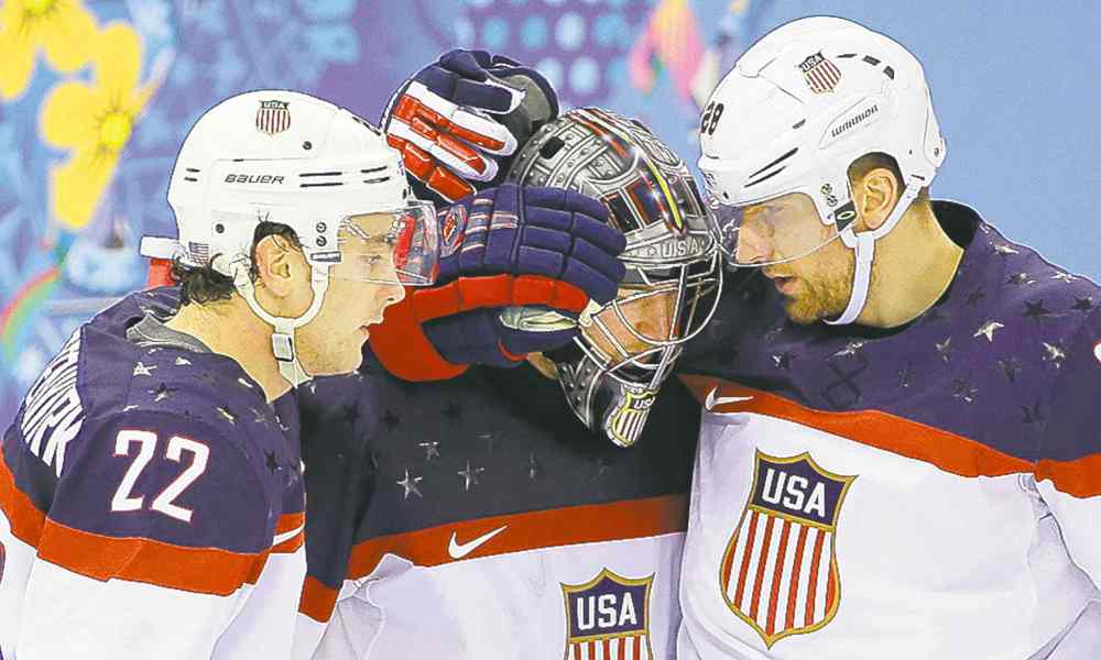 David J. Phillip / The Associated Press
USA defenseman Kevin Shattenkirk, goaltender Jonathan Quick and forward Blake Wheeler celebrate their 5-2 win over the Czech Republic after the men's quarterfinal hockey game in Shayba Arena at the 2014 Winter Olympics, Wednesday, Feb. 19, 2014, in Sochi, Russia.
