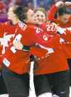 CP
Mark Humphrey / the associated press
Canada�s Natalie Spooner (left) and Hayley Wickenheiser of Canada celebrate their 3-2 overtime win over the U.S. in the women�s gold-medal game.