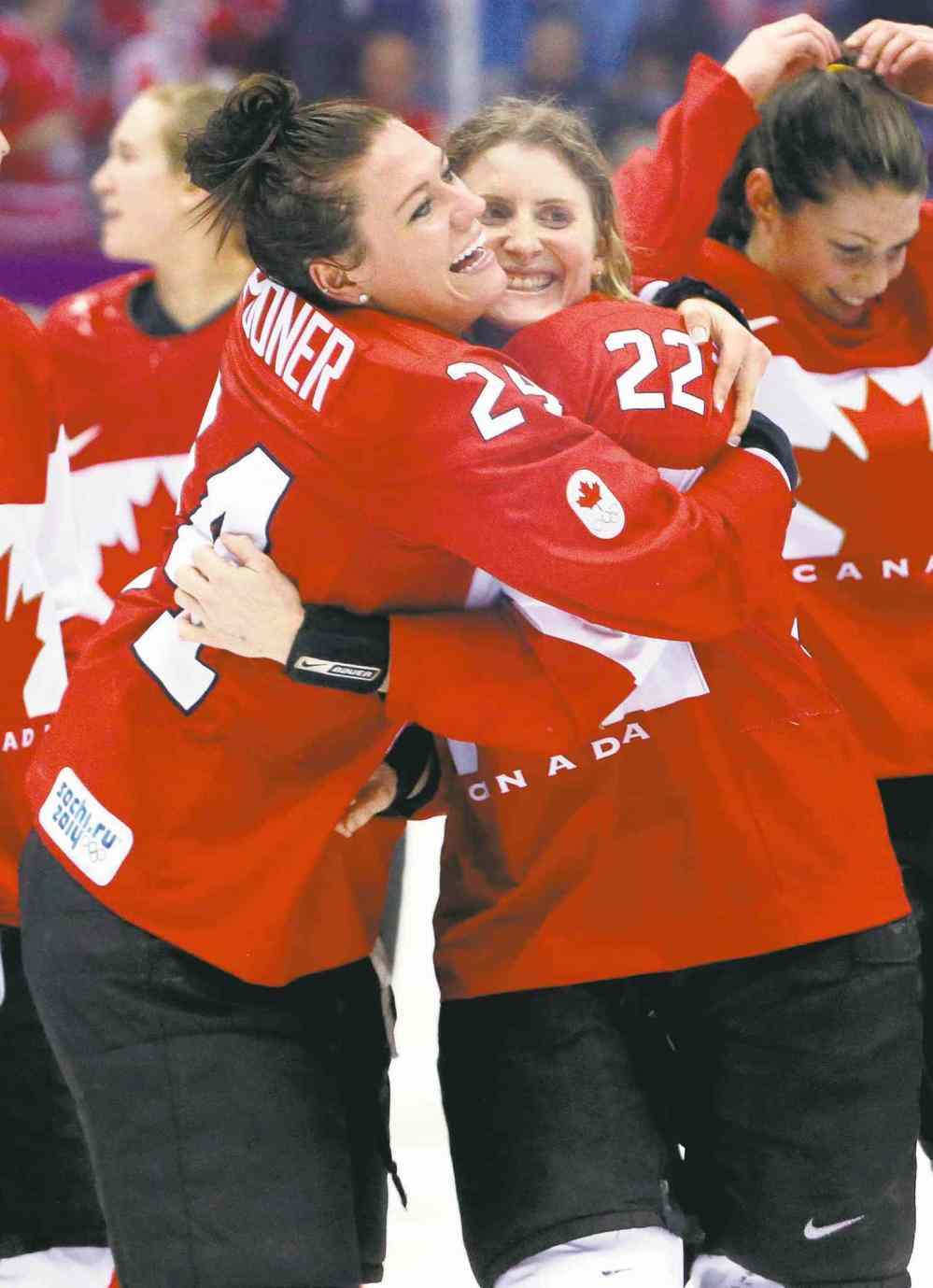 CP
Mark Humphrey / the associated press
Canada�s Natalie Spooner (left) and Hayley Wickenheiser of Canada celebrate their 3-2 overtime win over the U.S. in the women�s gold-medal game.