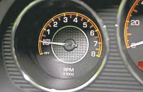 AutoStop is a feature or program that automatically turns off the vehicle’s engine after a short period when you’re sitting at idle.