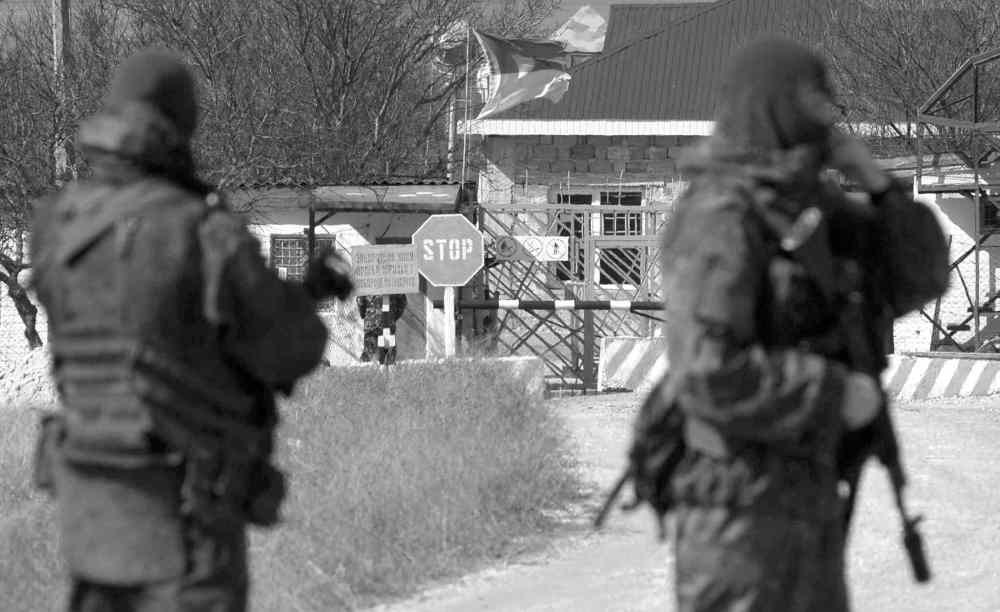 CP
Ivan Sekretarev / the associated press
Pro-Russian soldiers block the Ukrainian naval base in the village of Novoozerne, 91 kilometres west of Crimea�s capital Simferopol, in Ukraine, on Monday.