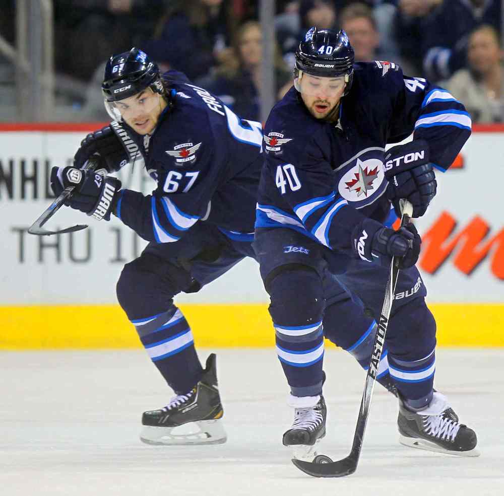 Phil Hossack / Winnipeg Free Press
Linemates Devin Setoguchi (right) and Michael Frolik were among Winnipeg's most effective players against the stifling brilliance of the Kings' defence.