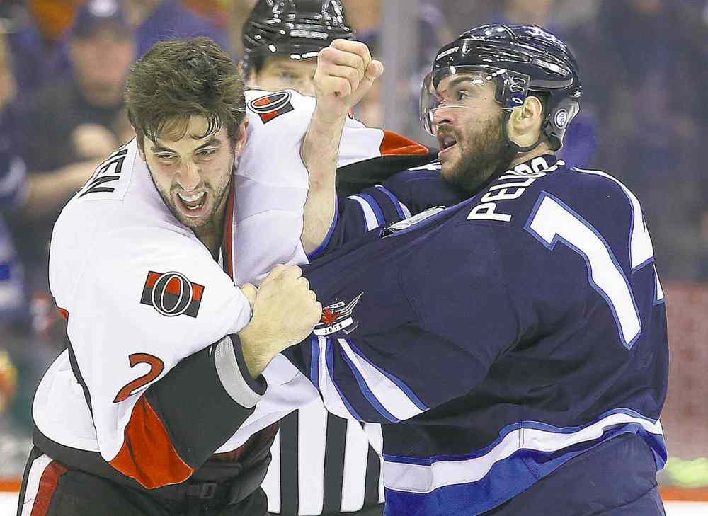 TREVOR HAGAN / WINNIPEG FREE PRESS
Ottawa�s Jared Cowen (left) and Winnipeg�s Anthony Peluso engage in second-period fisticuffs.