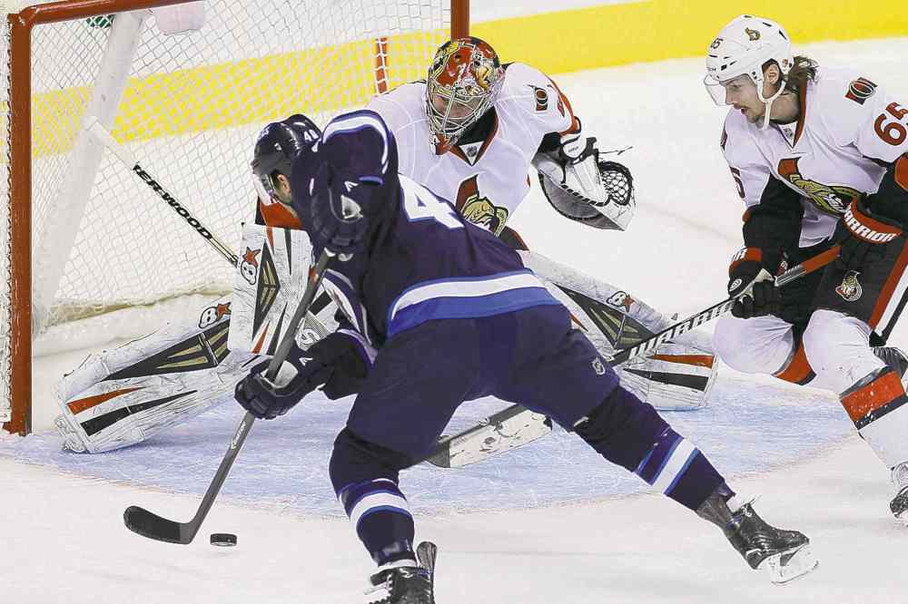 CP
John Woods / the canadian press
Jets winger Devin Setoguchi can�t connect on this shot on Ottawa Senators goaltender Craig Anderson.