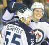 Chris O'Meara / Associated Press files
The Jets would be keen on having Jacob Trouba (United States) and Mark Scheifele (Canada) extend their seasons if asked.