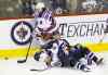 TREVOR HAGAN / WINNIPEG FREE PRESS
Jets� Bryan Little lands on Rangers� Derick Brassard as New York�s Mats Zuccarello skates past with the puck Friday night.