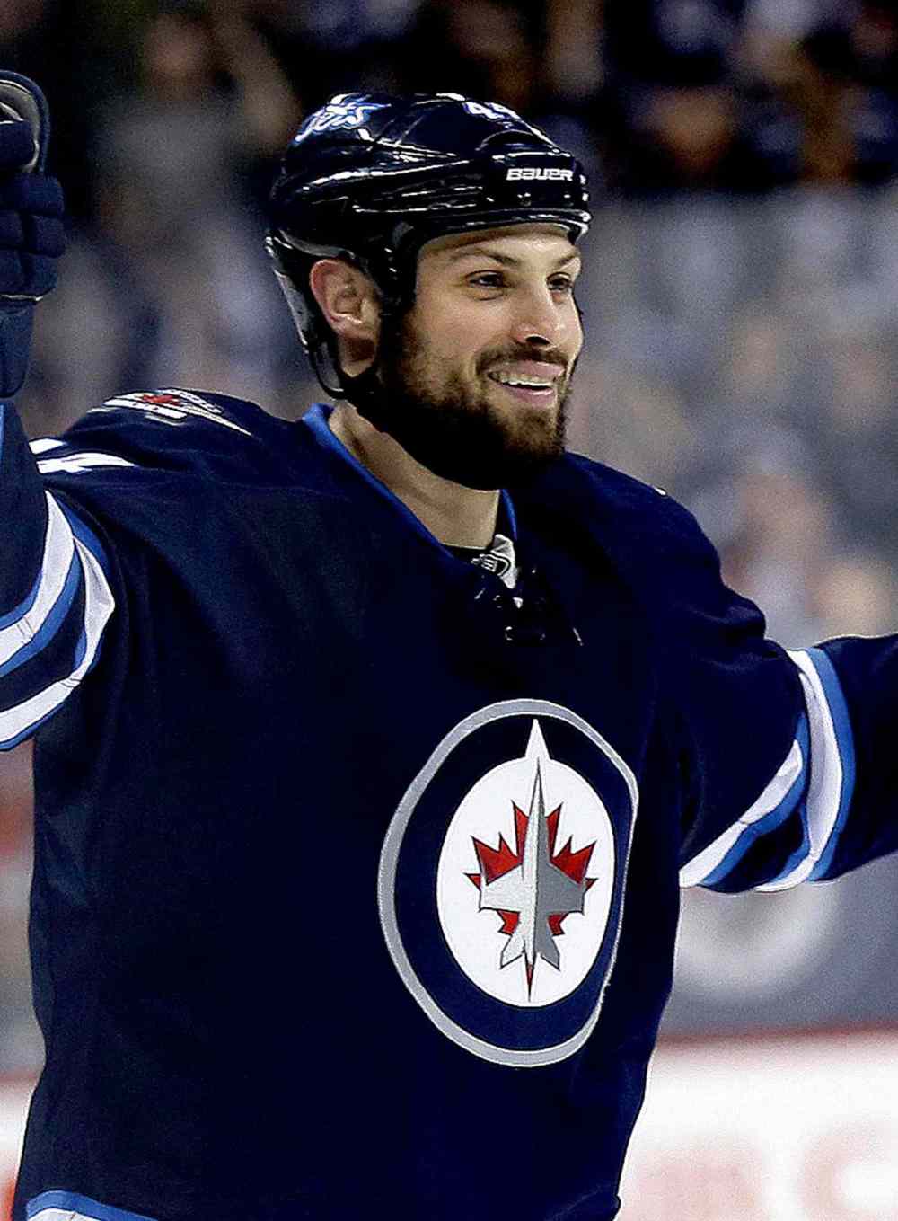 Winnipeg Jets' Zach Bogosian (44) celebrates after he scored against the Toronto Maple Leafs' during second period NHL hockey action at MTS Centre in Winnipeg, Saturday, January 25, 2014. (TREVOR HAGAN/WINNIPEG FREE PRESS)