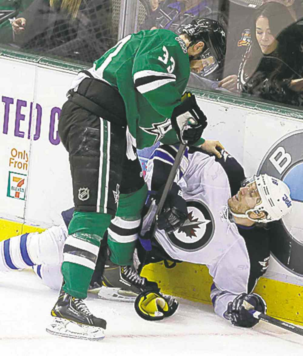 CP
L.M. Otero / The Associated Press
Bryan Little is knocked down.