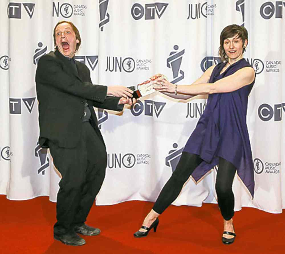 Mike Rud, left, win Vocal Jazz Album of the Year with Notes on Montreal ft. Sienna Dahlen, right, at the RBC Convention Centre in Winnipeg on Saturday, March 29, 2014. (Photo by Crystal Schick/Winnipeg Free Press)