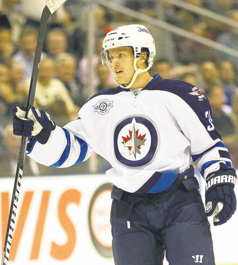 The Canadian Press files
Winnipeg Jets defenceman Tobias Enstrom celebrates his goal against the Toronto Maple Leafs during first period NHL action in Toronto on Wenesday October 19, 2011.