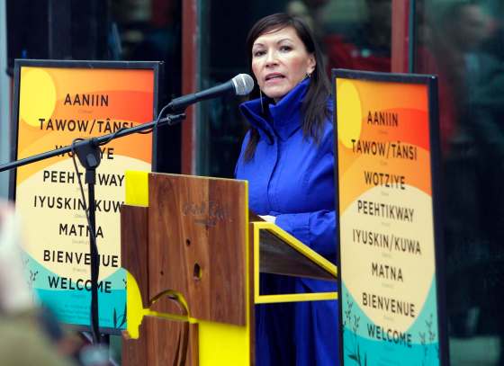 BORIS MINKEVICH / WINNIPEG FREE PRESSManito Ahbee Exec. Director Lisa Meeches helps launch new aboriginal-language signs that will be put up at downtown businesses.