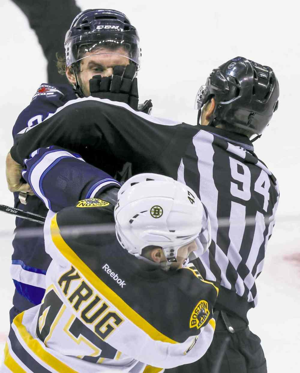 Crystal Schick / Winnipeg Free Press
Jets forward Eric Tangradi dusts it up with Bruins defender Torey Krug in the second period.