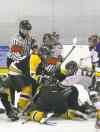 Chris Gareau photoA linesman is kicked and punched by players while prone on the ice in Stonewall.