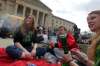 photos by BORIS MINKEVICH / WINNIPEG FREE PRESS
Eric Sorrie, with fellow marijuana advocates (top), lights up at the legislature Tuesday during 4/20 celebrations.