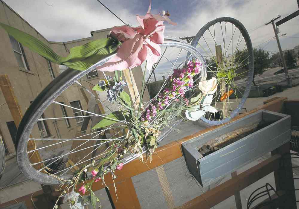 Bicycle art decorates a rooftop balcony at the Red Road Lodge.