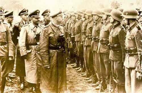 U.S. Holocaust Memorial Museum / The Associated Press files
Heinrich Himmler (centre), head of the Gestapo and the Waffen-SS and minister of the interior of Nazi Germany from 1943 to 1945, reviews troops in June 1944.