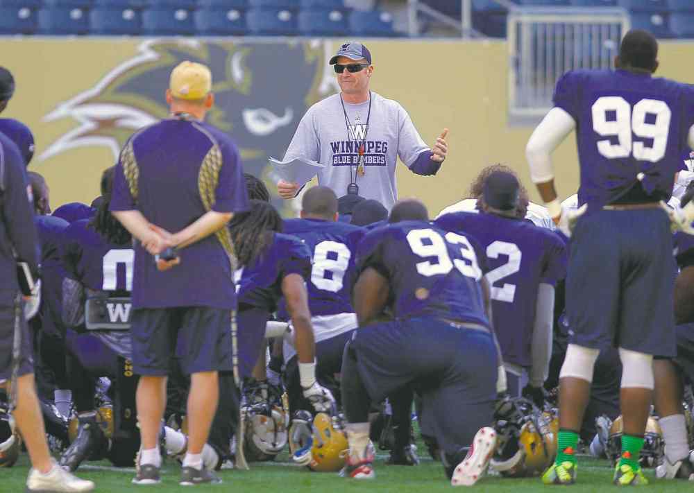 Winnipeg Blue Bombers coach Mike O'Shea talks to the team after the first half of today's practicee at the Investers Group Field. BORIS MINKEVICH / WINNIPEG FREE PRESS June 3, 2014