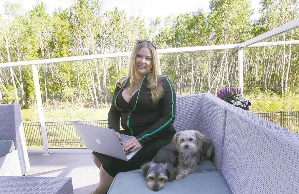 Wayne Glowacki / Winnipeg Free Press
Tara Maltman-Just sits outside on her deck at home with her dogs, Calla and Lilly.