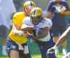 boris minkevich / winnipeg free press files
Paris Cotton, getting a handoff, will be fighting for work alongside Will Ford and Nic Grigsby.