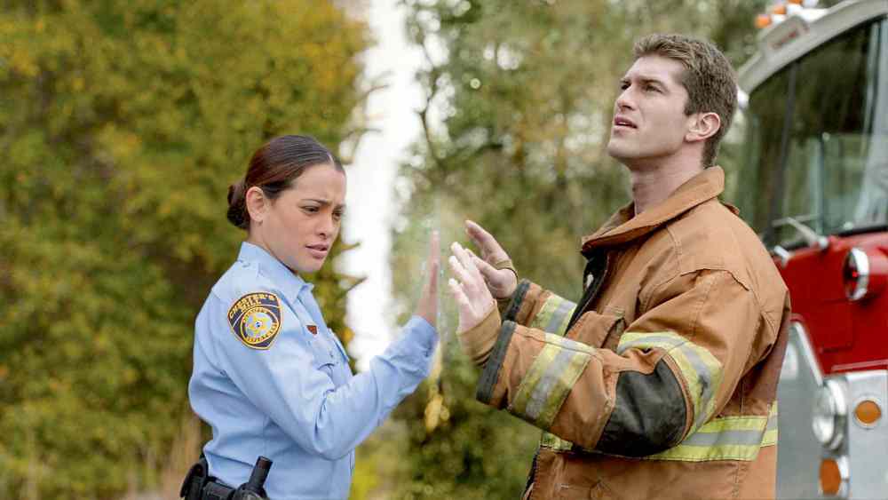 CP
CBS Entertainment
Natalie Martinez (left) and Josh Carter in Under the Dome, a CBS miniseries about a small town that is suddenly and inexplicably sealed off from the rest of the world by a massive, transparent dome.