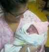 Early arrival Maela Maher is held by mom Jenna on Friday.