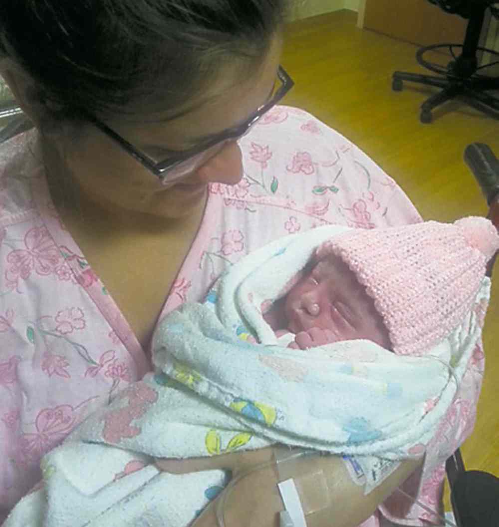 Early arrival Maela Maher is held by mom Jenna on Friday.
