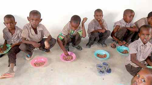 Preschoolers enjoy a lunch of rice and beans at the Humankind  Academy.