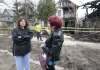 Neda Procner (left) and Linda Walker look at Procner&rsquo;s house on Maryland Street.