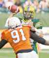 Jason Franson / the canadian press files
Eskimos QB Mike Reilly absorbed some heavy punishment and many losses in 2013, but has rebounded superbly in 2014.